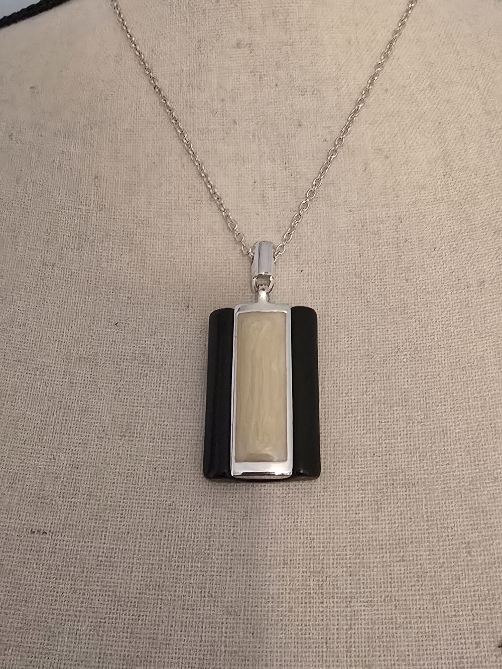 3 Necklaces.  1 Black Cream Pendant   1 Turquoise And Brown Pendant, 1 Silver(26